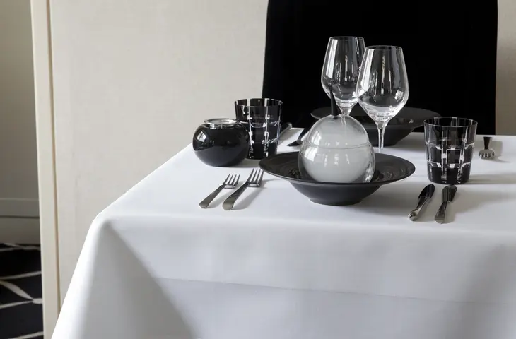 Table dressed with satin stripe tablecloth