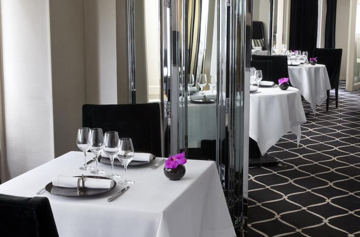 Dress table in dining room with white napkin and tablecloth in restaurant White napkin and table cloth in restaurant