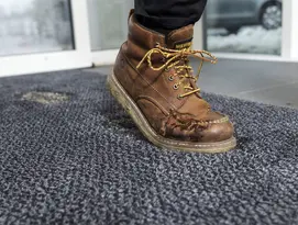 Mat absorbing dirt and mud