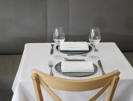 Dining table set with linen